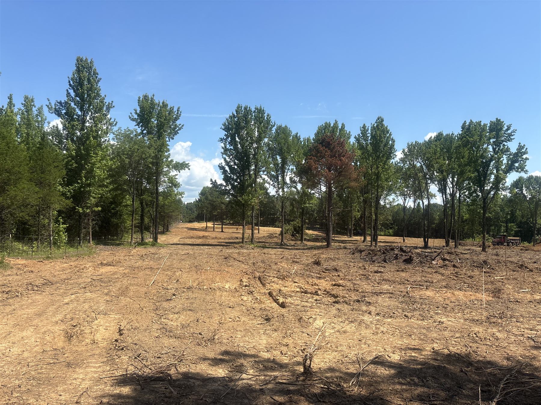 Land clearing in progress with equipment on site